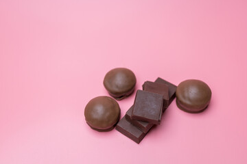 Valentine dark chocolate on pink background, Valentines Day Theme