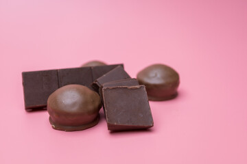 Valentine dark chocolate on pink background, Valentines Day Theme