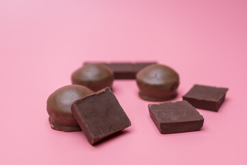 Valentine dark chocolate on pink background, Valentines Day Theme