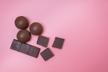 Valentine dark chocolate on pink background, Valentines Day Theme