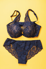 Set of lingerie blue on a yellow background, top view