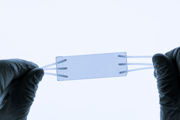 Organ on chip OOC and lab on chip LOC - microfluidic device chip that simulates biological organs and laboratory device . Prototype of design lab-on-a-chip LOC in microfluidic laboratory