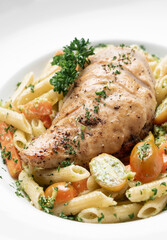 fried chicken breast with penne and saute vegetables pasta dish