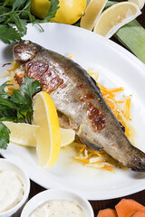 Restaurant serving concept.Sea food. Sea bass baked on the grill. Close-up.