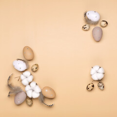 Easter eggs on beige pastel background with space for text. Flat lay image composition, top view.