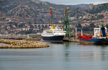Classic old cruiseship or cruise ship liner in dry dock modernisation for repair, maintenance or...