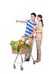 A happy young couple are Grocery shopping 