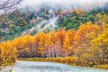 Kamikochi National Park in the Northern Japan Alps of Nagano Prefecture, Japan. Beautiful mountain in autumn leaf with river.