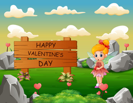 Happy Valentines Day wooden sign with little angel at nature