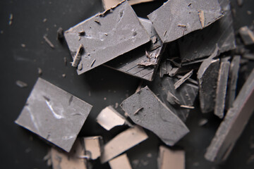 Delicious dark chocolate on black dish