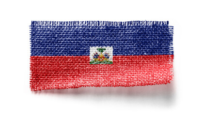 Haiti flag on a piece of cloth on a white background