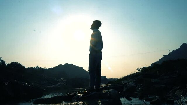 silhouette of a person in the mountains - slow motion