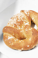 vegan dairy-free organic german pretzel bread on white table