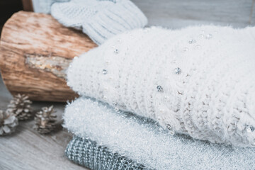 Fototapeta na wymiar folded cotton jumpers sweaters with wool