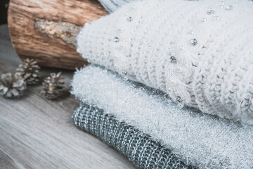 Fototapeta na wymiar folded cotton jumpers sweaters with wool