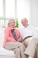 Senior couple holding a bunch of roses