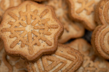 Delicious homemade cookies on a wooden table on a homespun fabric with a rough texture. Close-up selective focus.