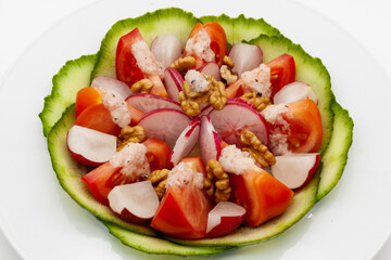 Low carb vegetable salad with walnuts and homemade vinaigrette sauce