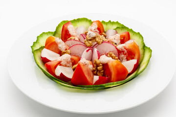 Low carb vegetable salad with walnuts and homemade vinaigrette sauce