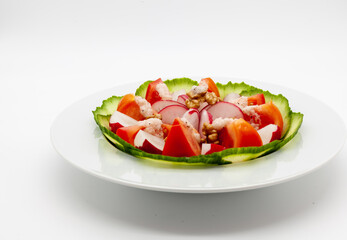 Low carb vegetable salad with walnuts and homemade vinaigrette sauce