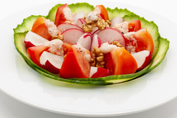 Low carb vegetable salad with walnuts and homemade vinaigrette sauce