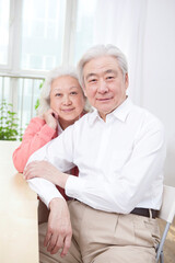 A group photo of a happy old couple