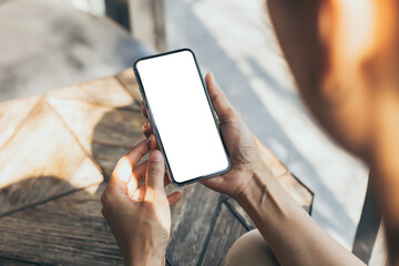 cell phone blank white screen mockup.woman hand holding texting using mobile on desk at office.background empty space for advertise.work people contact marketing business,technology