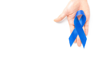 Cancer people. Blue ribbon in hands isolated on white background. Awareness prostate cancer of men health in Movember. Man Healthcare and World cancer day concept.