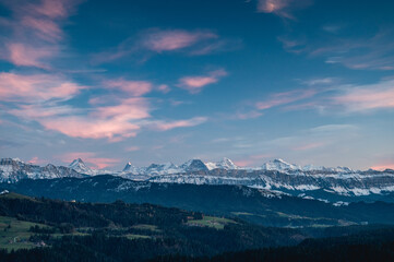 Bernese Alps at an autumn sunset with the hills of Emmental in front