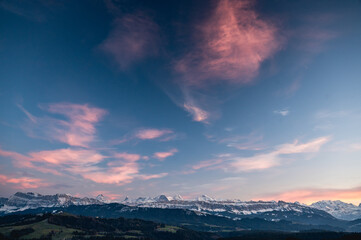 Bernese Alps at an autumn sunset with the hills of Emmental in front
