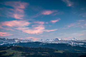 Fototapeta premium Bernese Alps at blue hour with the hills of Emmental in front