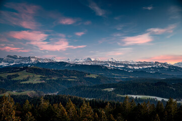 Bernese Alps with Eiger, Mönch and Jungfrau at an autumn sunset with the hills of Emmental in front