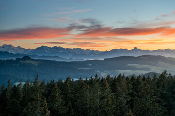 Fototapeta na wymiar Niesen and Stockhorn in the Bernese Alps seen from Emmental at sunset
