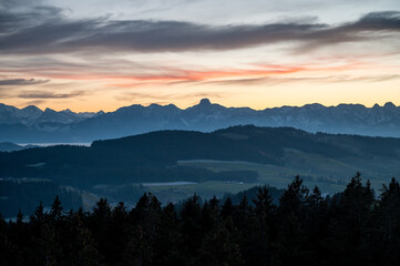 Naklejka premium mountain ridge with the peak of Stockhorn at an autumn sunset seen from Chuderhüsi
