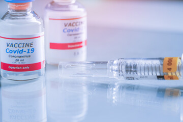  Medical concept of vaccination of hypodermic injection therapy. Vials of Covid-19 vaccine. Best protection for coronavirus.