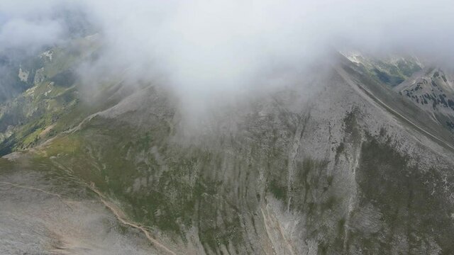 Aerial view of Kutelo Peak, covered with clouds, Pirin Mountain, Bulgaria