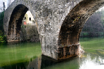 Old stone bridge photographed from the bottom