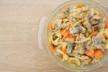 fresh homemade herring salad with apple and onions