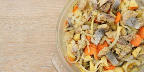 fresh homemade herring salad with apple and onions