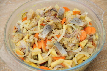 fresh homemade herring salad with apple and onions