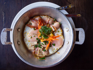Breakfast set, eggs in a pan with ham and bread Toasting  