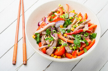Asian salad with vegetables and meat