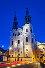 Fototapeta na wymiar facade and bell towers of a baroque church during the night