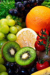 vertical closeup of fresh fruits with water drops, healthy food
