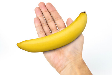 Male hand holding banana isolated on white background.