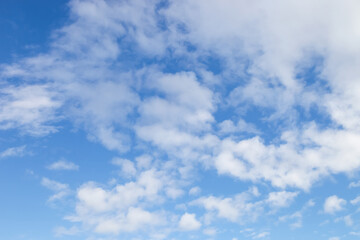 nature background., white clouds over blue sky soft focus.