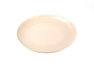 Circle beige ceramic plate isolated on a white background. Use for home, restaurant, food design. Kitchen accessory...