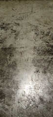 The texture of the concrete floor with cracks. 