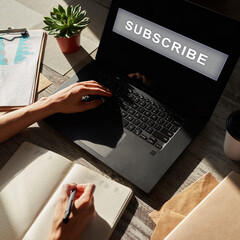 Subscribe button on device screen. Internet and digital marketing concept.