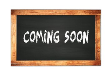 Obraz premium COMING SOON text written on wooden frame school blackboard.